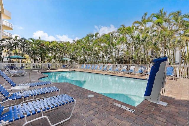 11605 Gulf Blvd Unit 203, Treasure Island, FL 33706 - community pool featuring a patio