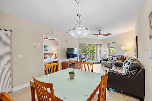 11605 Gulf Blvd Unit 203, Treasure Island, FL 33706 - dining area with a ceiling fan and light tile patterned floors