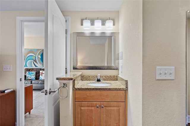 11605 Gulf Blvd Unit 203, Treasure Island, FL 33706 - bathroom with ensuite bath, vanity, tile patterned flooring, and a textured wall