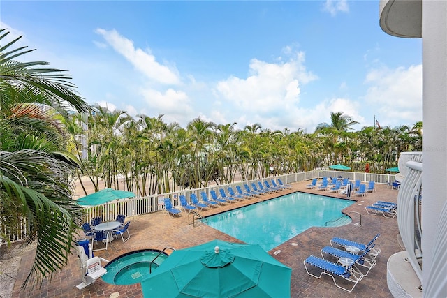 11605 Gulf Blvd Unit 203, Treasure Island, FL 33706 - community pool with a community hot tub and a patio