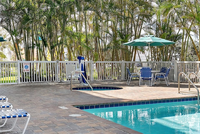11605 Gulf Blvd Unit 203, Treasure Island, FL 33706 - community pool featuring a patio