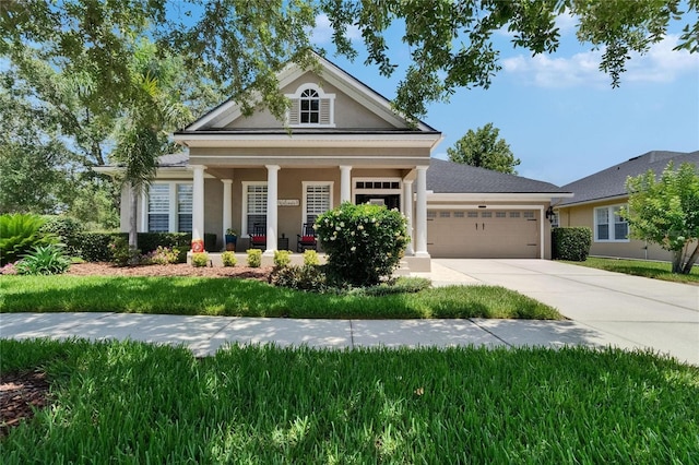 20537 Lace Cascade Rd, Land O Lakes, FL 34637 - neoclassical / greek revival house featuring an attached garage, concrete driveway, stucco siding, and a porch