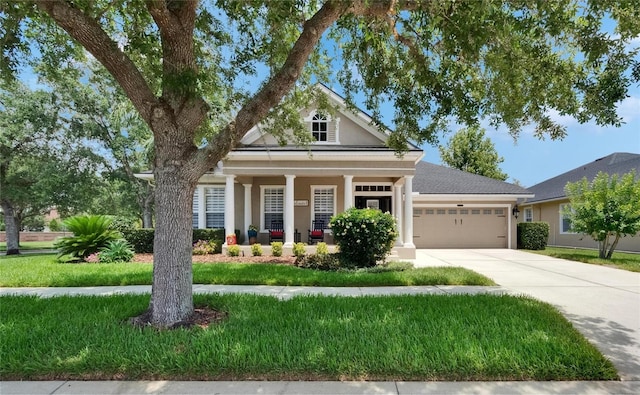 20537 Lace Cascade Rd, Land O Lakes, FL 34637 - view of front of home with an attached garage, driveway, stucco siding, a porch, and a front yard