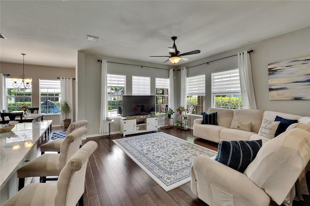20537 Lace Cascade Rd, Land O Lakes, FL 34637 - living area with a chandelier, a ceiling fan, and dark wood-style floors
