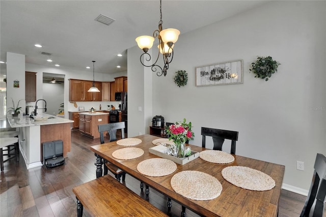 20537 Lace Cascade Rd, Land O Lakes, FL 34637 - dining area featuring dark wood finished floors, recessed lighting, a chandelier, a ceiling fan, and baseboards