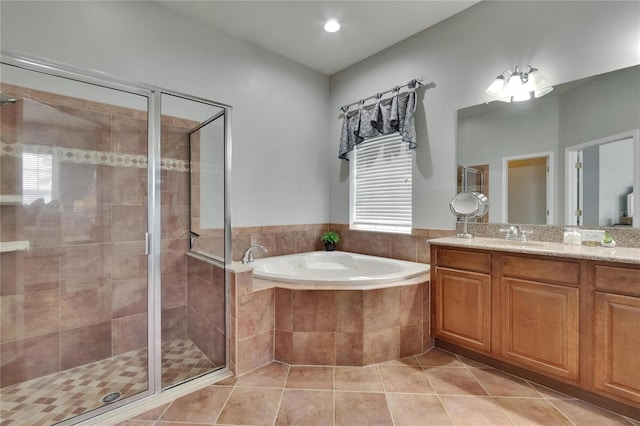 20537 Lace Cascade Rd, Land O Lakes, FL 34637 - bathroom with a bath, vanity, tile patterned flooring, a stall shower, and healthy amount of natural light