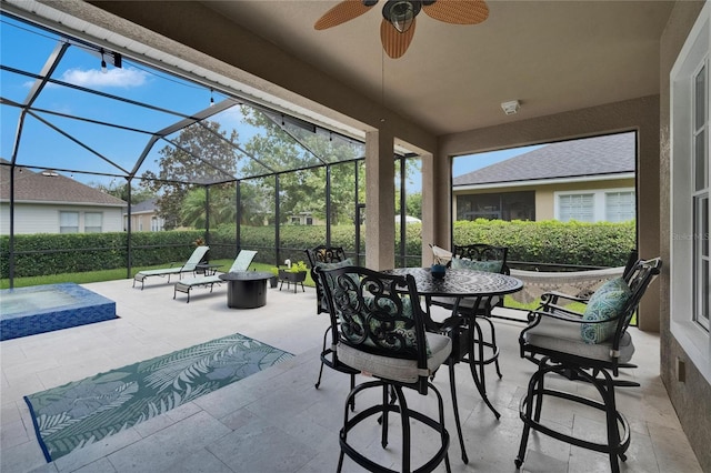 20537 Lace Cascade Rd, Land O Lakes, FL 34637 - view of patio featuring a ceiling fan, glass enclosure, and outdoor dining space