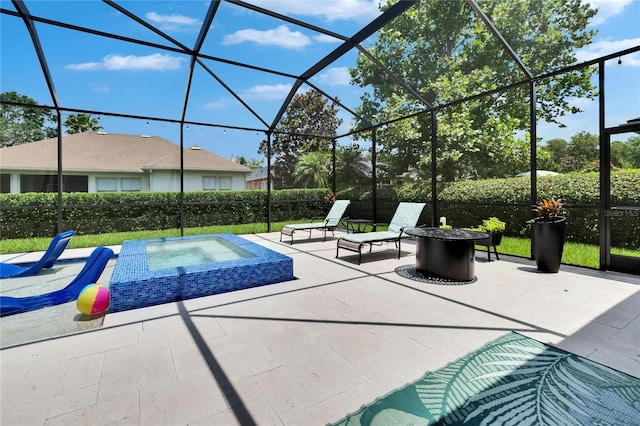 20537 Lace Cascade Rd, Land O Lakes, FL 34637 - view of pool featuring an in-ground hot tub, a patio, glass enclosure, and an outdoor fire pit