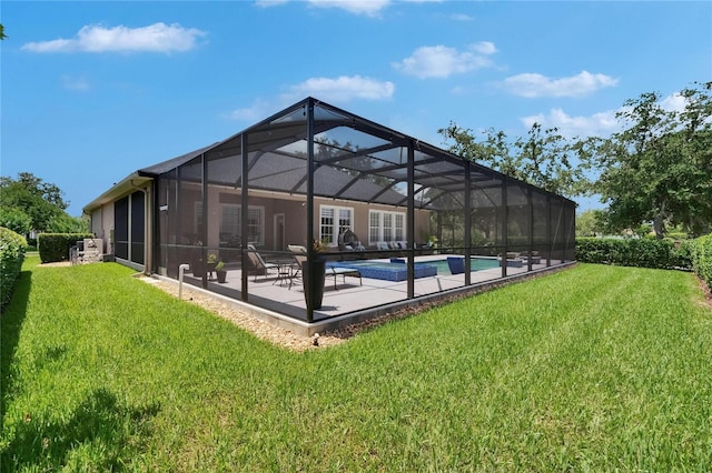 20537 Lace Cascade Rd, Land O Lakes, FL 34637 - swimming pool featuring a lawn, a patio, and glass enclosure