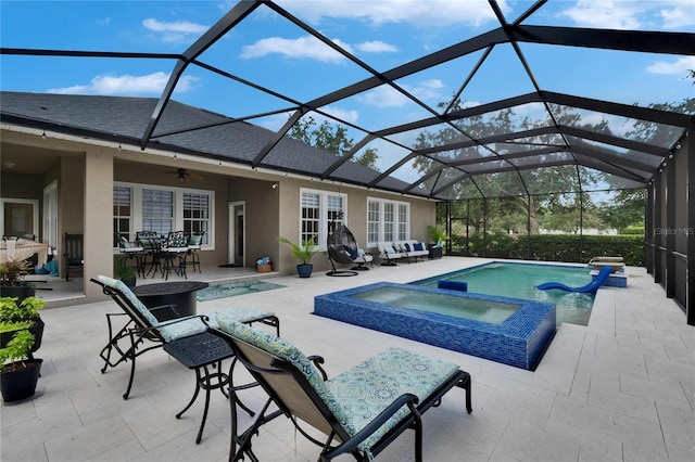 20537 Lace Cascade Rd, Land O Lakes, FL 34637 - view of pool featuring a patio area, outdoor dining area, a pool with connected hot tub, ceiling fan, and an outdoor living space