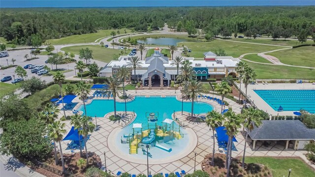 20537 Lace Cascade Rd, Land O Lakes, FL 34637 - view of pool featuring a view of trees and a water view