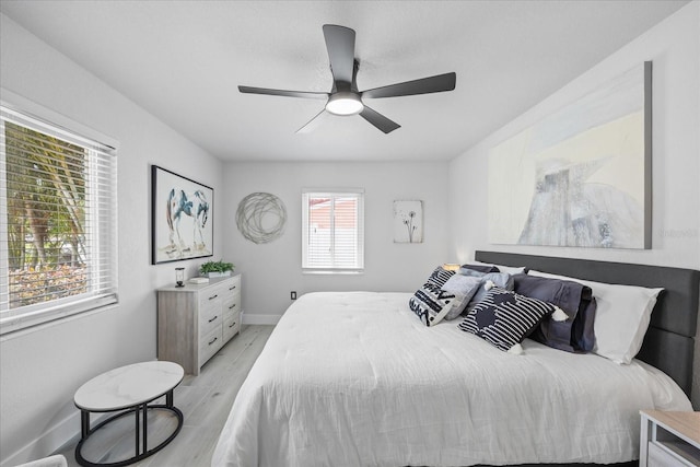 7889 3rd Ave S, Saint Petersburg, FL 33707 - bedroom featuring light wood-style floors, baseboards, and ceiling fan