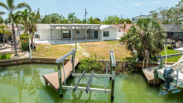 7889 3rd Ave S, Saint Petersburg, FL 33707 - dock with a patio area, boat lift, a water view, and a yard
