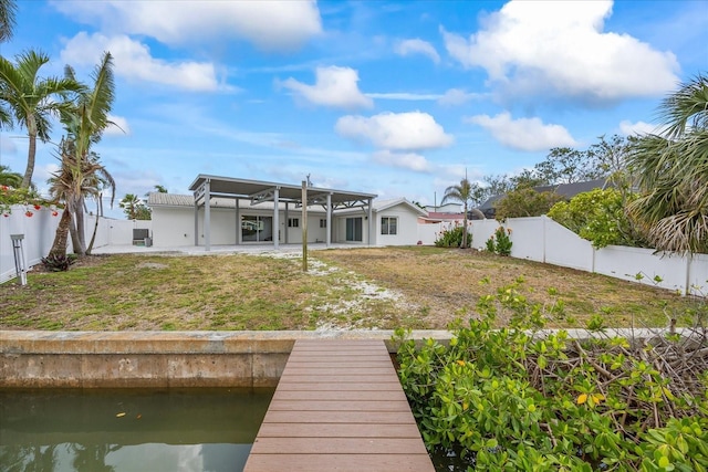 7889 3rd Ave S, Saint Petersburg, FL 33707 - back of property with a patio area, a fenced backyard, and a water view
