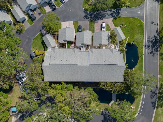 birds eye view of property with a residential view and a water view