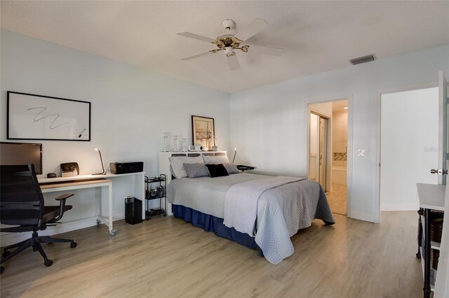 bedroom featuring baseboards, a ceiling fan, light wood finished floors, and visible vents