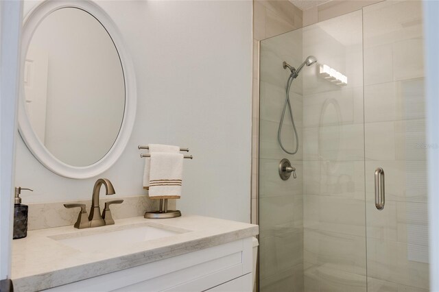 full bath featuring vanity and a stall shower