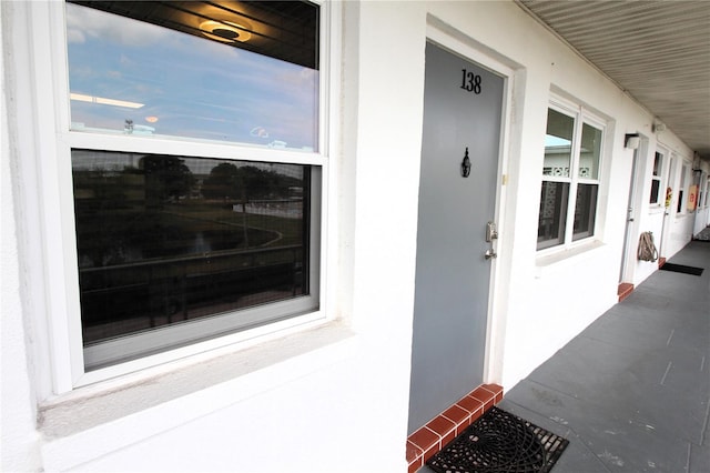 6000 20th St N Unit 138, Saint Petersburg, FL 33714 - view of exterior entry featuring stucco siding