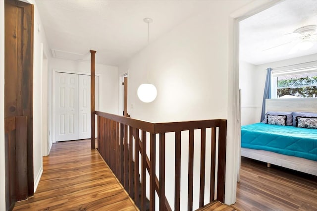 13902 Bardmoor Pl Unit B, Tampa, FL 33618 - corridor featuring wood finished floors and an upstairs landing