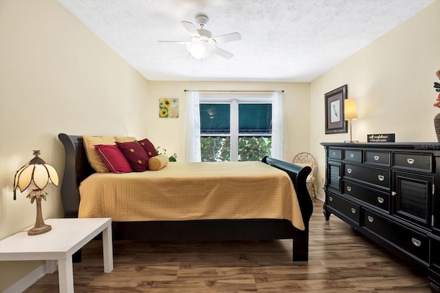 13902 Bardmoor Pl Unit B, Tampa, FL 33618 - bedroom featuring wood finished floors, ceiling fan, and a textured ceiling