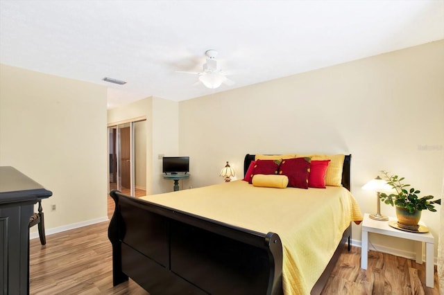 13902 Bardmoor Pl Unit B, Tampa, FL 33618 - bedroom with light wood-style flooring, baseboards, a closet, and a ceiling fan