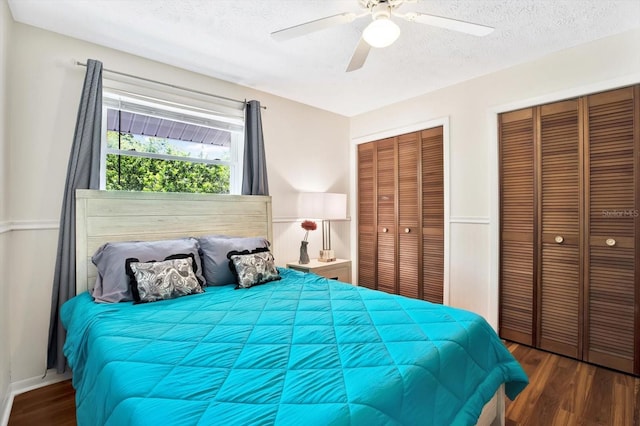 13902 Bardmoor Pl Unit B, Tampa, FL 33618 - bedroom with multiple closets, a textured ceiling, wood finished floors, and ceiling fan
