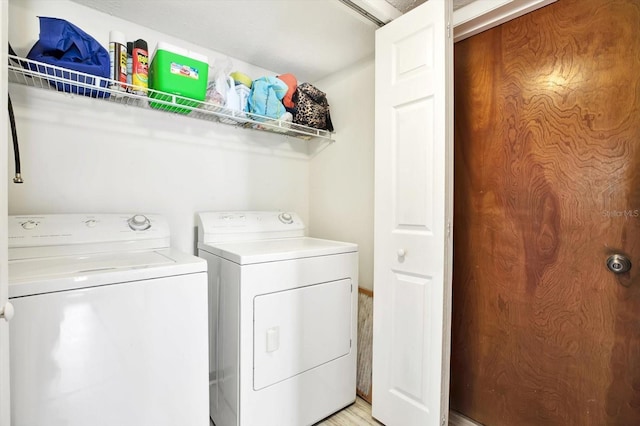 13902 Bardmoor Pl Unit B, Tampa, FL 33618 - laundry room with independent washer and dryer and light wood finished floors