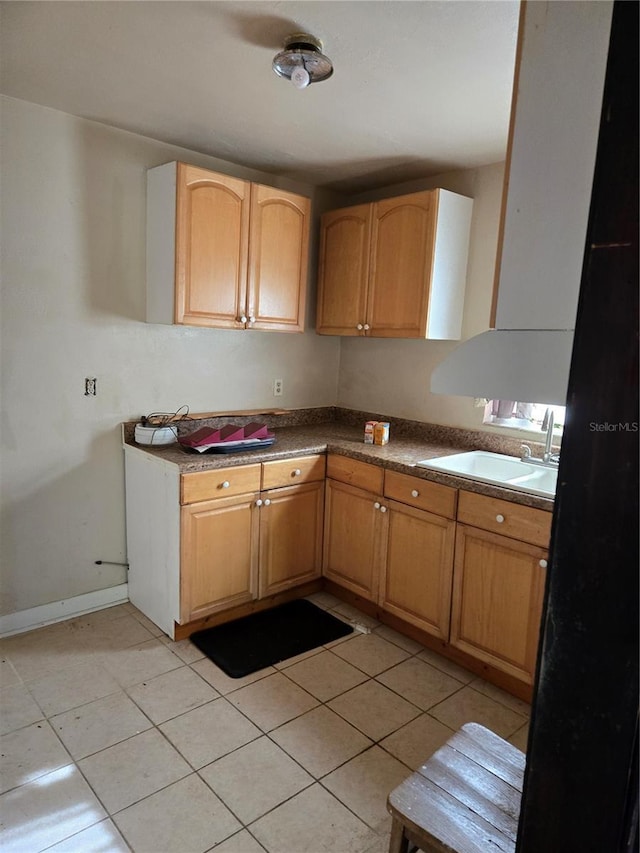 1125 Engman St, Clearwater, FL 33755 - kitchen featuring a sink, light tile patterned floors, and baseboards