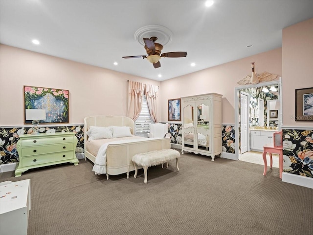 bedroom featuring recessed lighting, ceiling fan, dark carpet, and ensuite bath