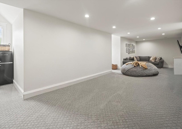 carpeted living room featuring recessed lighting and baseboards
