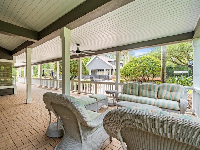 view of patio / terrace with ceiling fan and outdoor lounge area