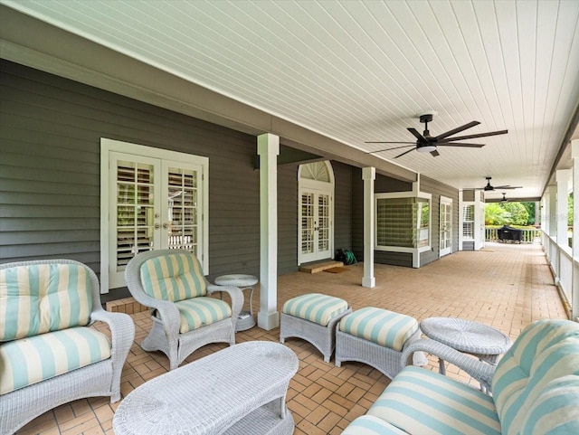 view of patio featuring an outdoor living space, french doors, and ceiling fan