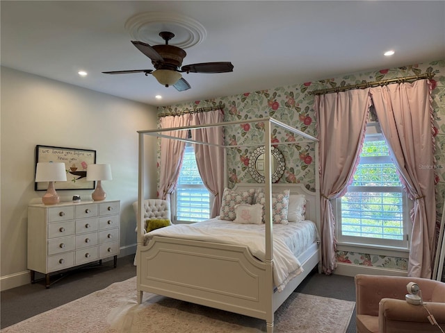 bedroom with baseboards, carpet flooring, wallpapered walls, and multiple windows