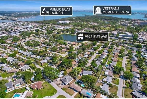 bird's eye view featuring a water view and a residential view