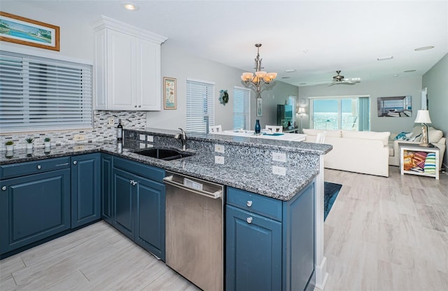 3 7th Ave Unit 3, Indian Rocks Beach, FL 33785 - kitchen with stainless steel dishwasher, a peninsula, a sink, a chandelier, and open floor plan