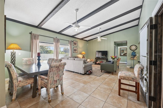 2906 Beagle Pl, Seffner, FL 33584 - dining space featuring light tile patterned flooring, a textured ceiling, vaulted ceiling with beams, and ceiling fan