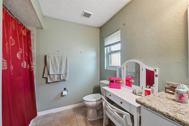 2906 Beagle Pl, Seffner, FL 33584 - bathroom with vanity, baseboards, a textured ceiling, toilet, and visible vents