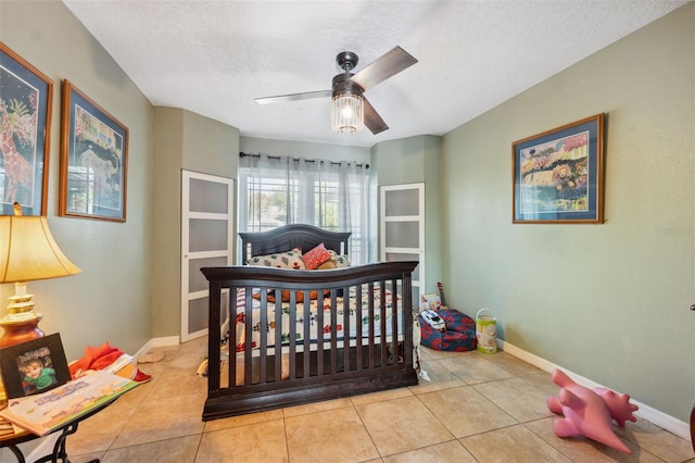 2906 Beagle Pl, Seffner, FL 33584 - tiled bedroom featuring baseboards, a textured ceiling, and ceiling fan