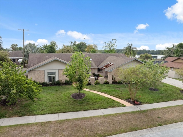 2906 Beagle Pl, Seffner, FL 33584 - ranch-style home featuring a front lawn and brick siding
