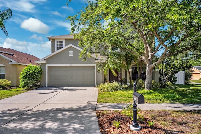 11519 Cypress Reserve Dr, Tampa, FL 33626 - view of front of property featuring a garage, a front yard, stucco siding, and concrete driveway