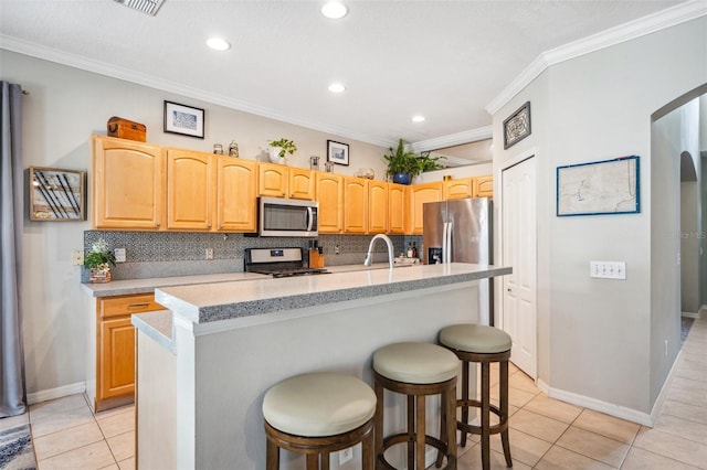 11519 Cypress Reserve Dr, Tampa, FL 33626 - kitchen featuring light tile patterned flooring, a sink, backsplash, and stainless steel appliances