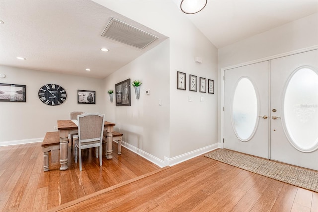 entrance foyer featuring recessed lighting, baseboards, visible vents, and hardwood / wood-style flooring