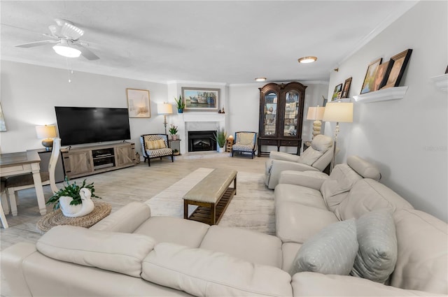 1600 Gulf Blvd Unit 212, Clearwater Beach, FL 33767 - living room featuring crown molding, ceiling fan, and a fireplace