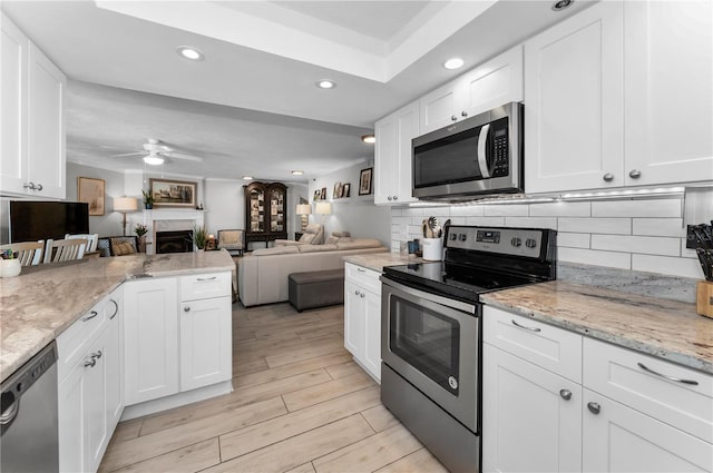 1600 Gulf Blvd Unit 212, Clearwater Beach, FL 33767 - kitchen featuring recessed lighting, open floor plan, appliances with stainless steel finishes, and ceiling fan