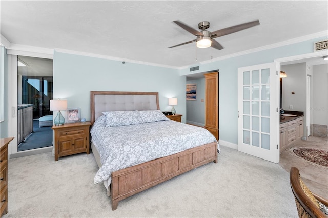 1600 Gulf Blvd Unit 212, Clearwater Beach, FL 33767 - bedroom featuring crown molding, light colored carpet, a sink, and visible vents