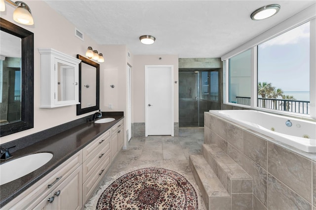 1600 Gulf Blvd Unit 212, Clearwater Beach, FL 33767 - full bathroom featuring a tub with jets, visible vents, a shower stall, and a sink