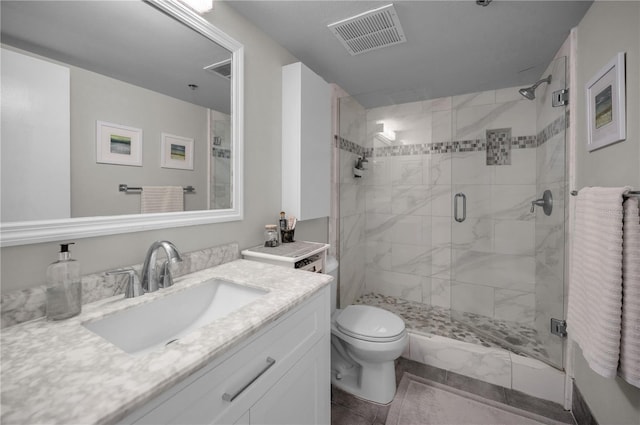1600 Gulf Blvd Unit 212, Clearwater Beach, FL 33767 - bathroom featuring visible vents, vanity, toilet, and a shower stall