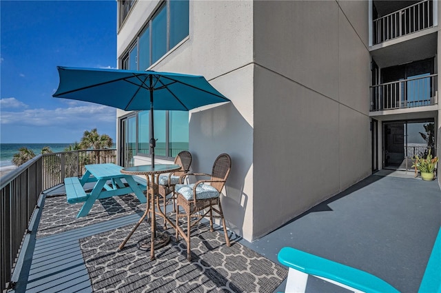 1600 Gulf Blvd Unit 212, Clearwater Beach, FL 33767 - view of patio / terrace featuring outdoor dining area and a water view