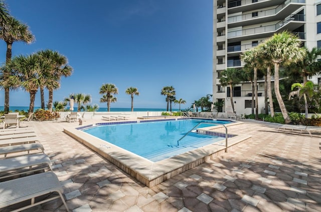 1600 Gulf Blvd Unit 212, Clearwater Beach, FL 33767 - pool featuring a water view and a patio area