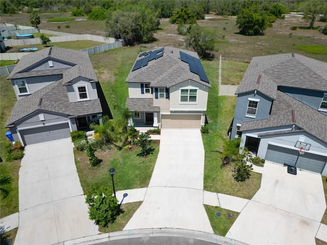 birds eye view of property with a residential view